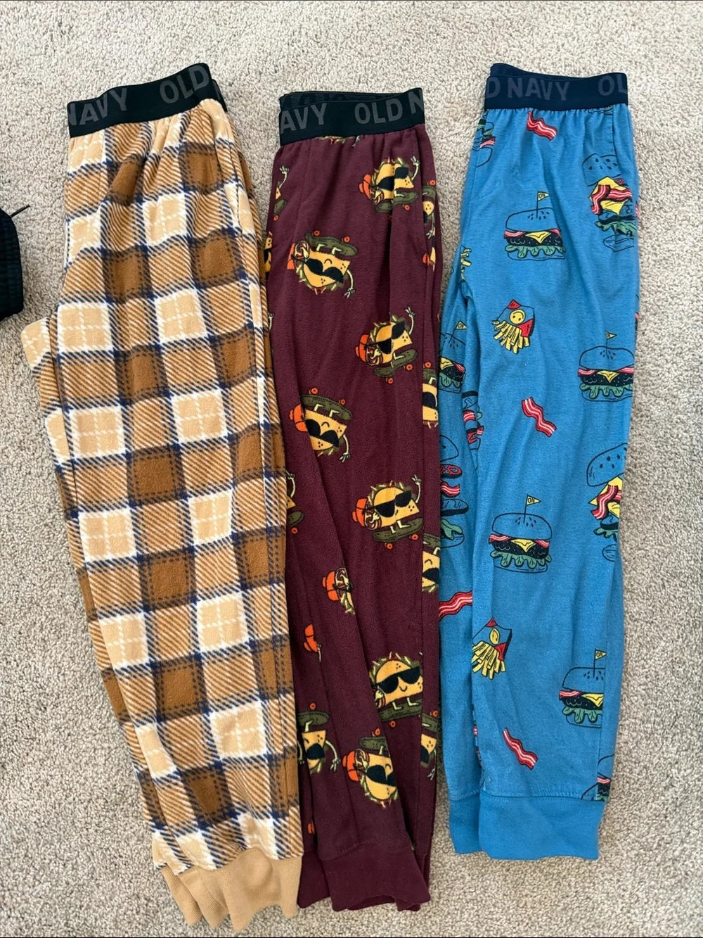 Old Navy Kids Three-Pack Pajama Pants — Tan Plaid, Burgundy Cartoon, Blue Burger
